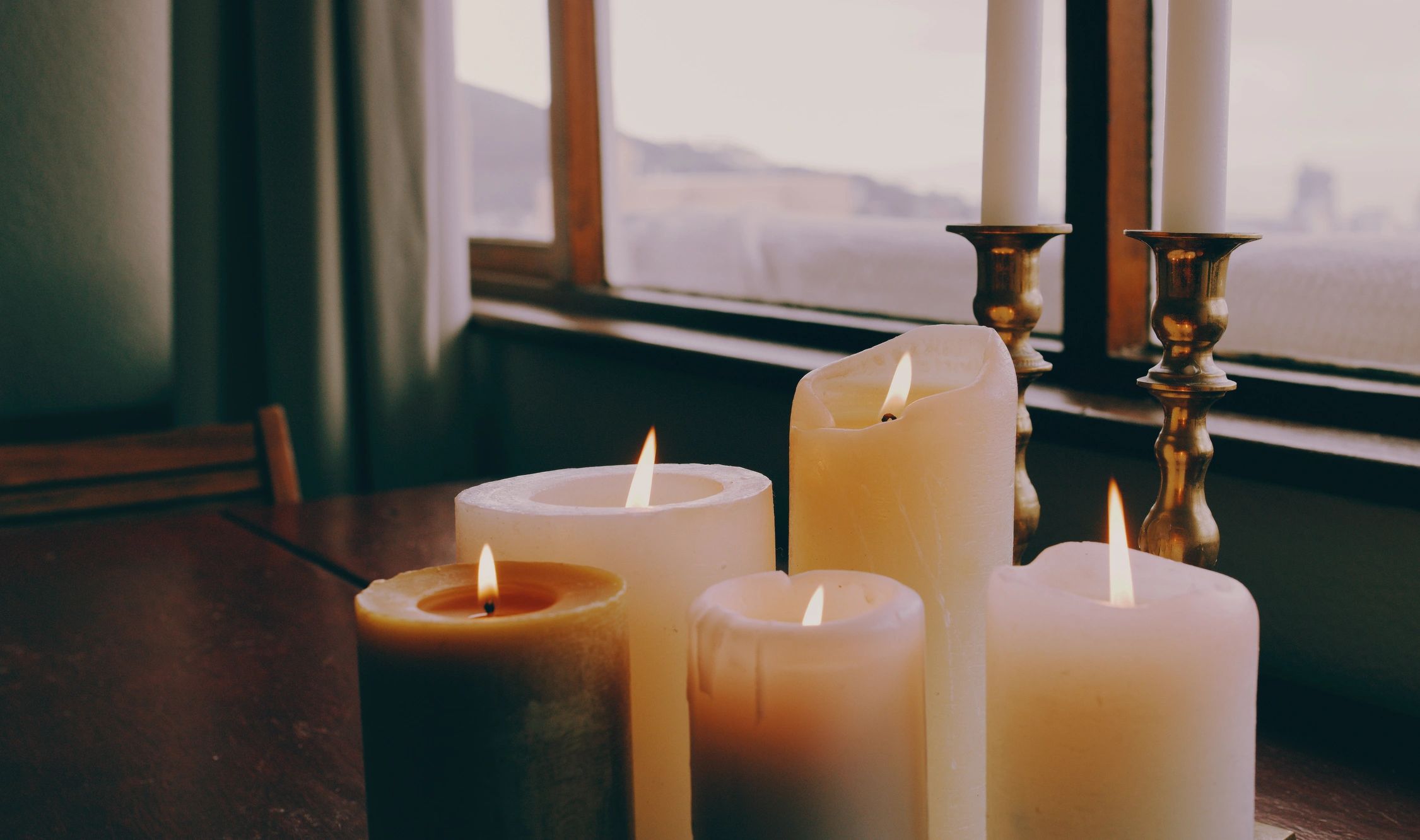 Warm candlelit tabletop scene