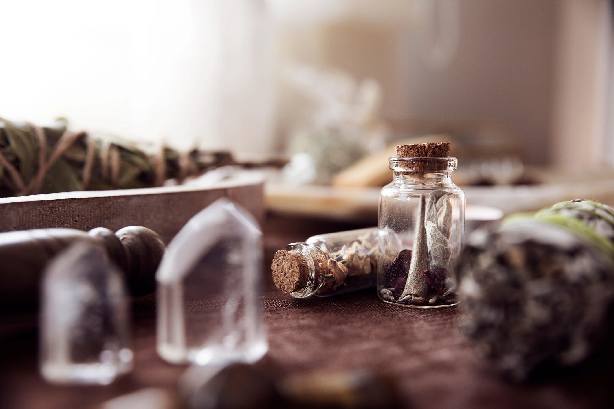 Herbs and ritual jars arranged on an esoteric altar